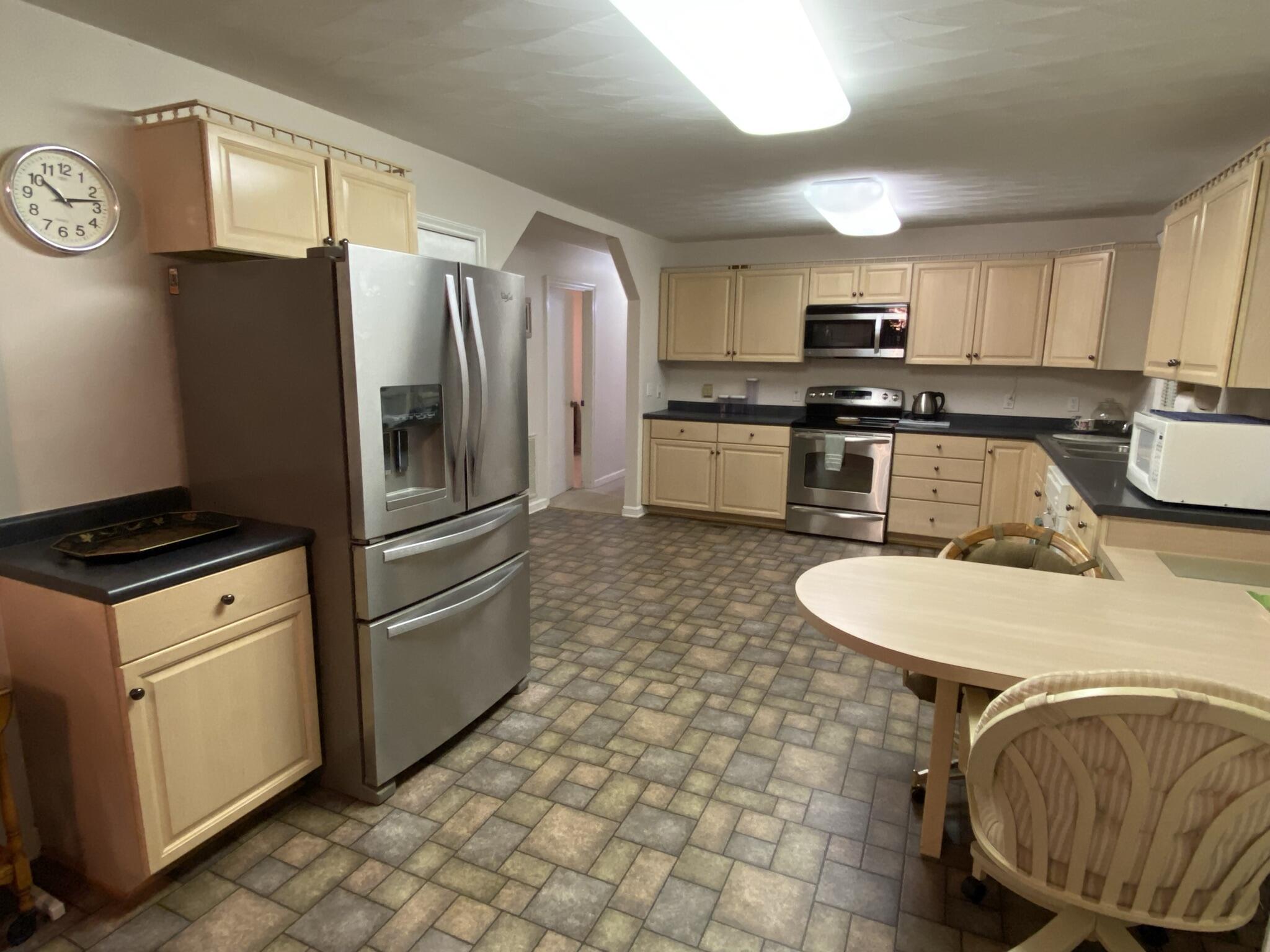 5378 Ferrum Mountain Road Callaway, VA 24067 - Photo 7 of 71 a kitchen with stainless steel appliances granite countertop a sink a stove a refrigerator a washer and dryer
