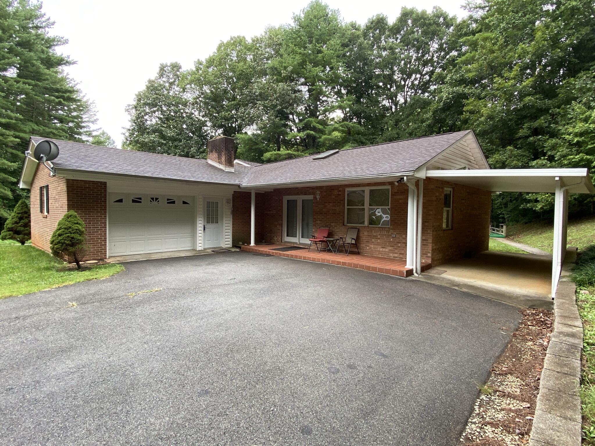 5378 Ferrum Mountain Road Callaway, VA 24067 - Photo 64 of 71 a view of a house with a yard and potted plants