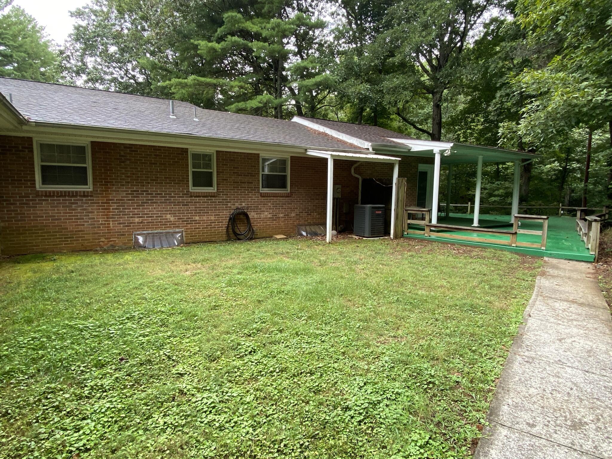 5378 Ferrum Mountain Road Callaway, VA 24067 - Photo 65 of 71 a view of a house with a yard and sitting area