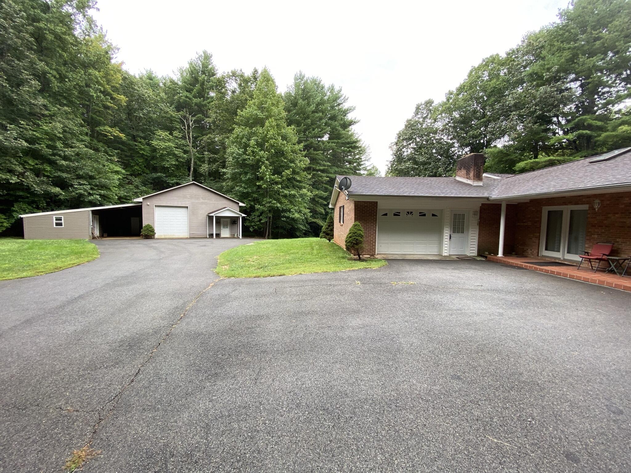 5378 Ferrum Mountain Road Callaway, VA 24067 - Photo 67 of 71 a view of a house with a yard and garage