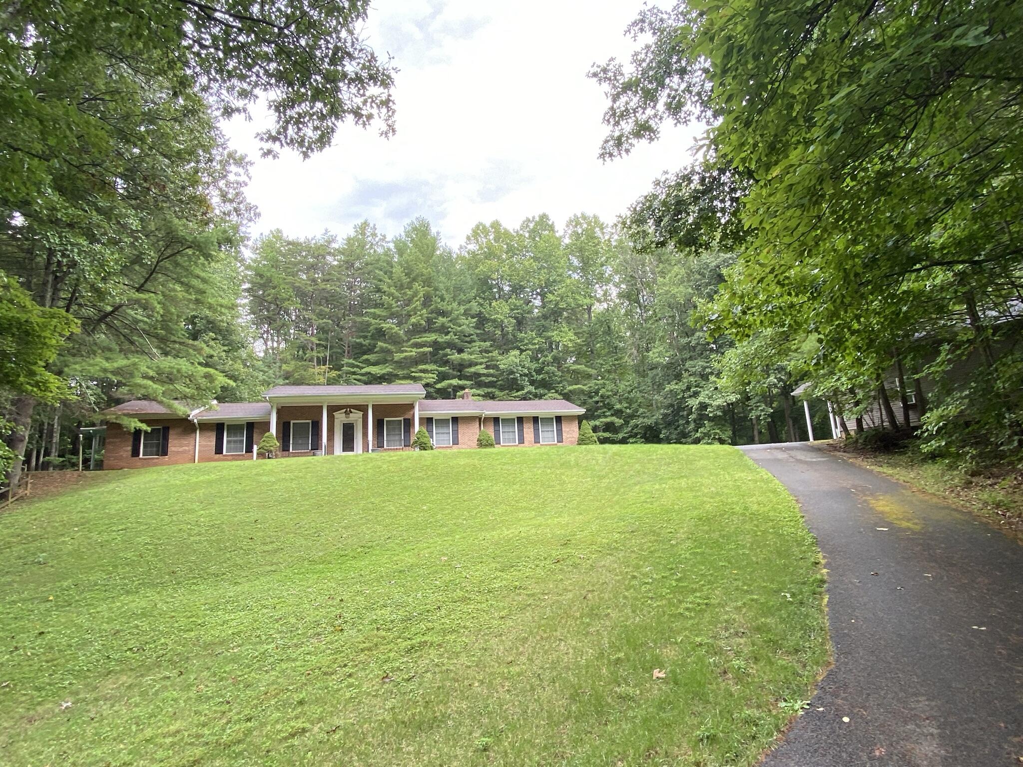 5378 Ferrum Mountain Road Callaway, VA 24067 - Photo 69 of 71 a front view of a house with a garden