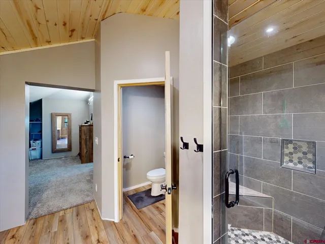 a view of a bathroom from a hallway