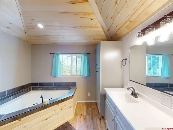 a bathroom with a bathtub and a sink