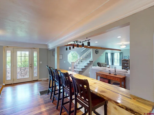 a view of a dining room with furniture window and wooden floor