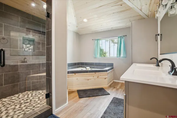 a kitchen with a sink a stove and cabinets