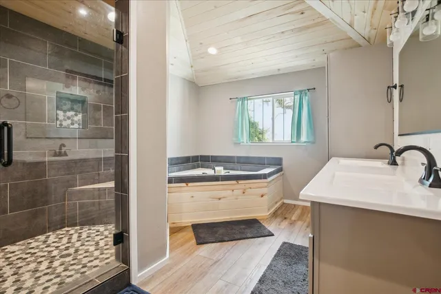 a kitchen with a sink a stove and cabinets