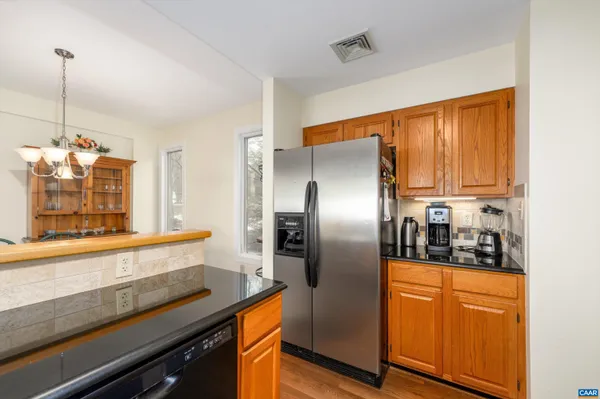 a kitchen with a stove and a microwave