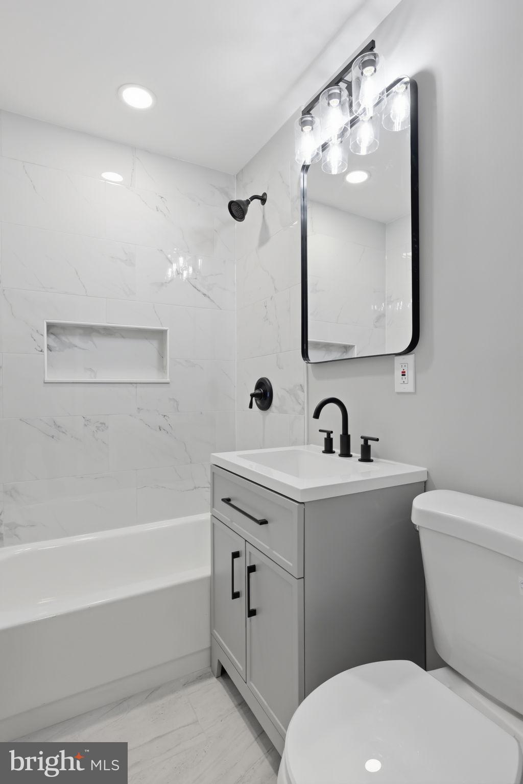 340 West Broad Street Hatfield, PA 19440 - Photo 30 of 55 a bathroom with a toilet a sink and a bathtub