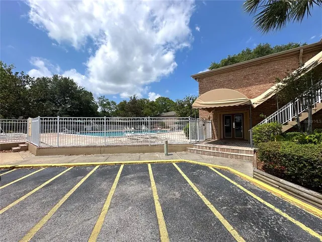 a view of a swimming pool with an outdoor seating