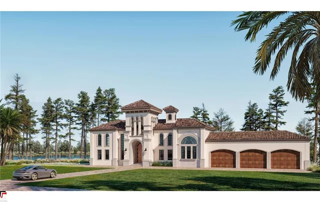 a view of house with yard and trees in the background