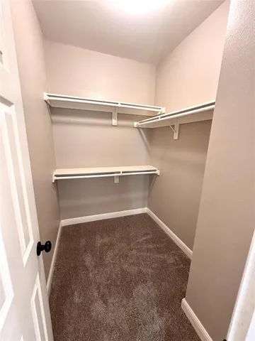 a bathroom with a sink a light fixture and a mirror