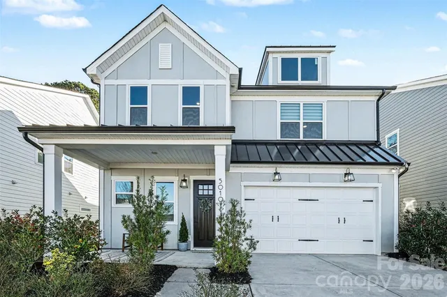 a front view of a house with a garage