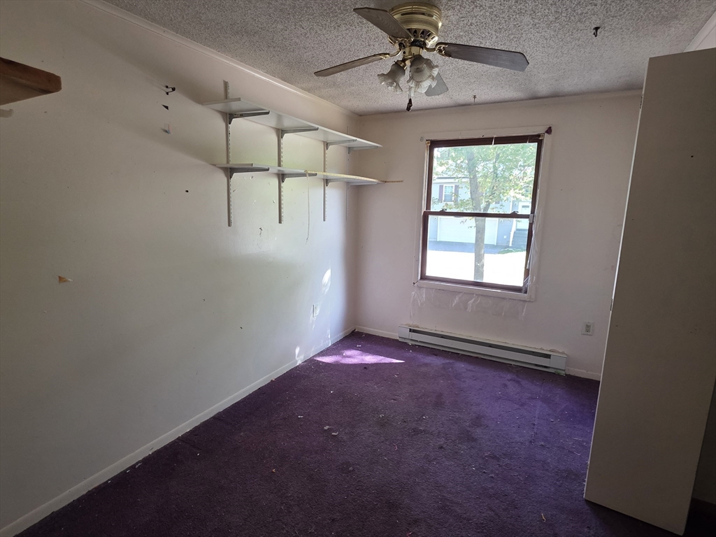 71 Wendell Street Athol, MA 01331 - Photo 11 of 12 an empty room with windows and fan
