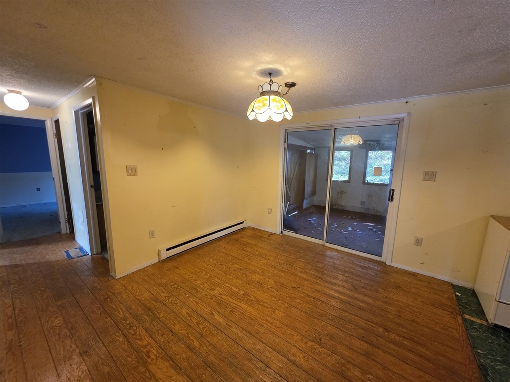 71 Wendell Street Athol, MA 01331 - Photo 6 of 12 a view of an empty room with a window