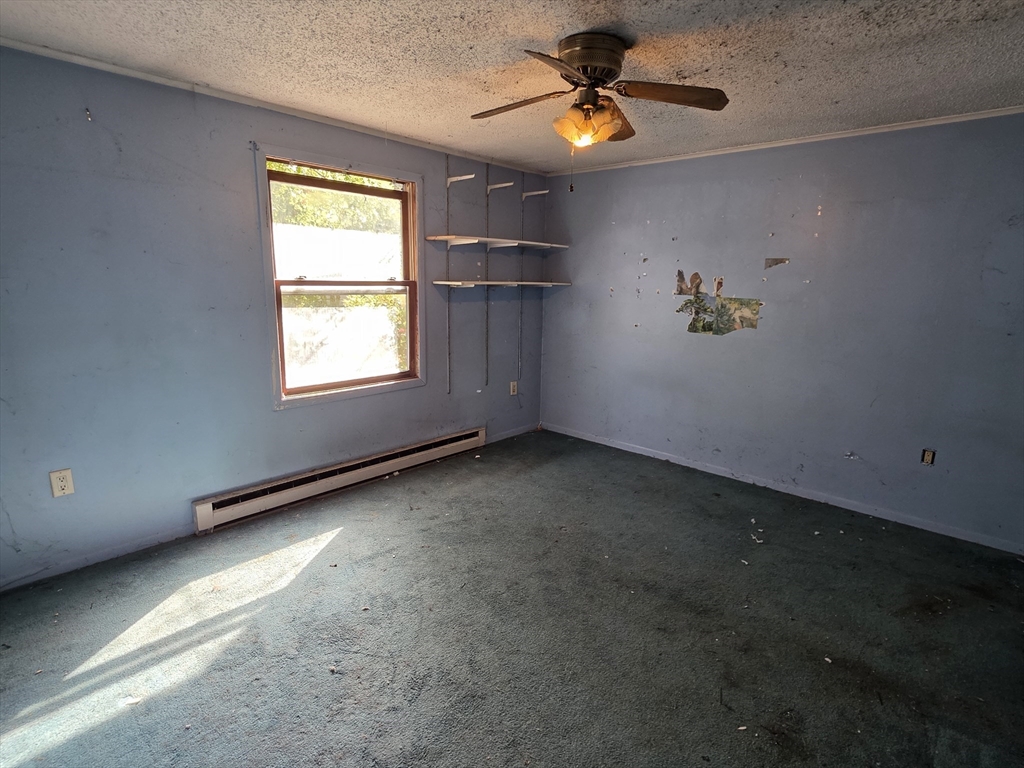 71 Wendell Street Athol, MA 01331 - Photo 10 of 12 an empty room with a window and a fan