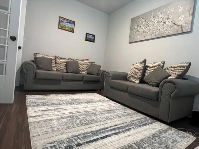 a living room with furniture and a couch