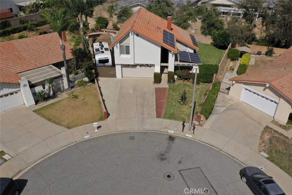10424 Cartilla Court Rancho Cucamonga, CA 91737 - Photo 1 of 36 an aerial view of a house with swimming pool and large trees