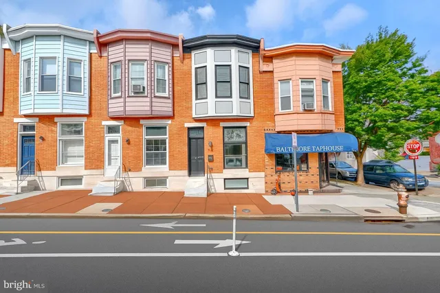 a outdoor view of a building with a yard