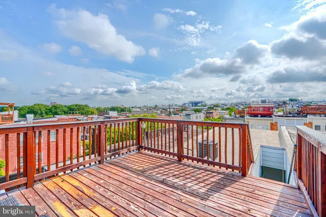 a balcony with wooden floor