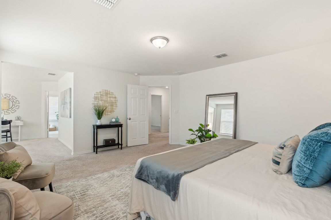 7808 Lawford Way Austin, TX 78744 - Photo 20 of 40 Carpeted bedroom with multiple windows