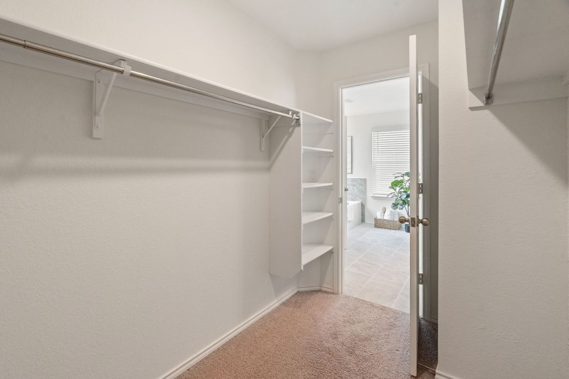 7808 Lawford Way Austin, TX 78744 - Photo 26 of 40 Walk in closet with light carpet