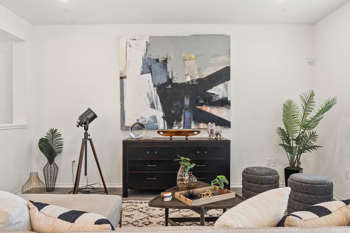 7808 Lawford Way Austin, TX 78744 - Photo 10 of 40 Living room featuring wood finished floors and baseboards