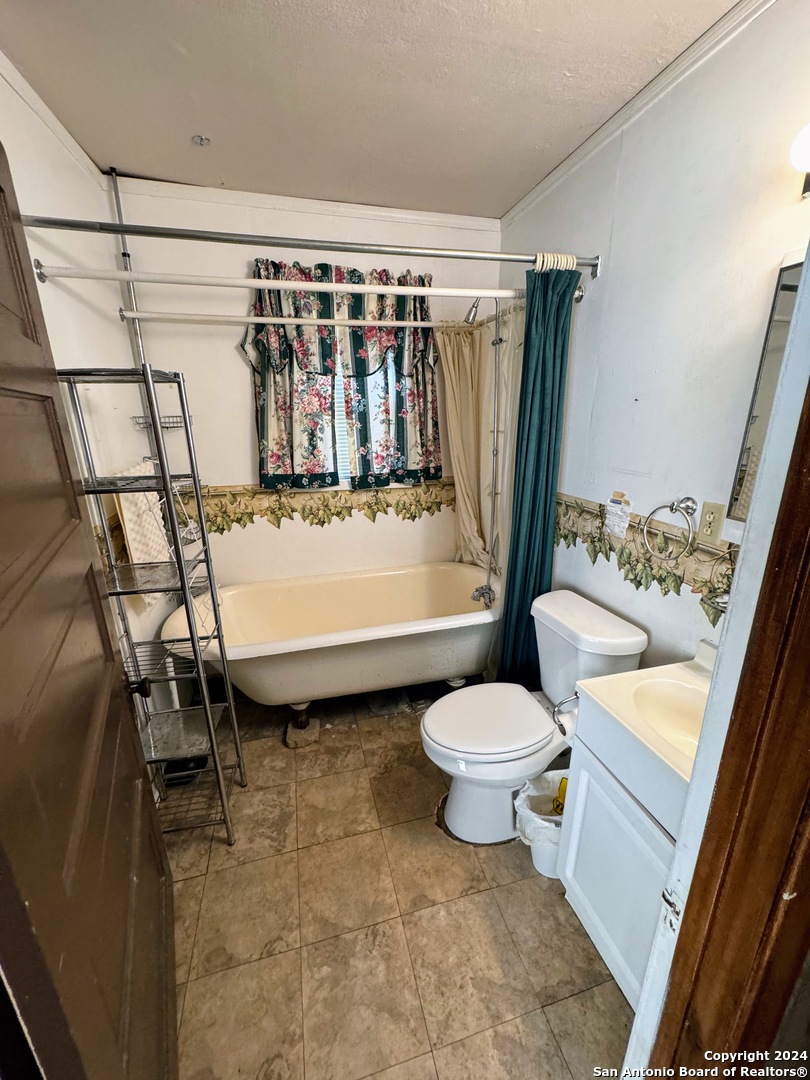 201 Cypress Bluff Road Pipe Creek, TX 78063 - Photo 14 of 16 a bathroom with a sink toilet and shower