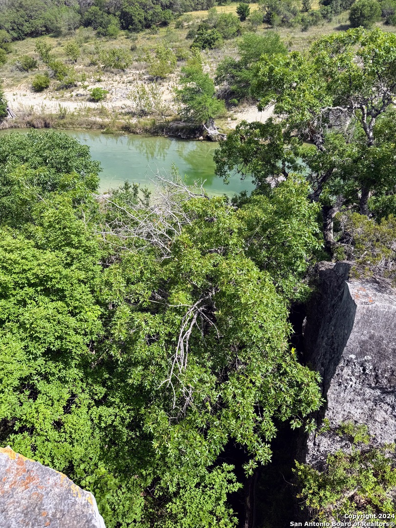 201 Cypress Bluff Road Pipe Creek, TX 78063 - Photo 4 of 16 a view of a lake with a park