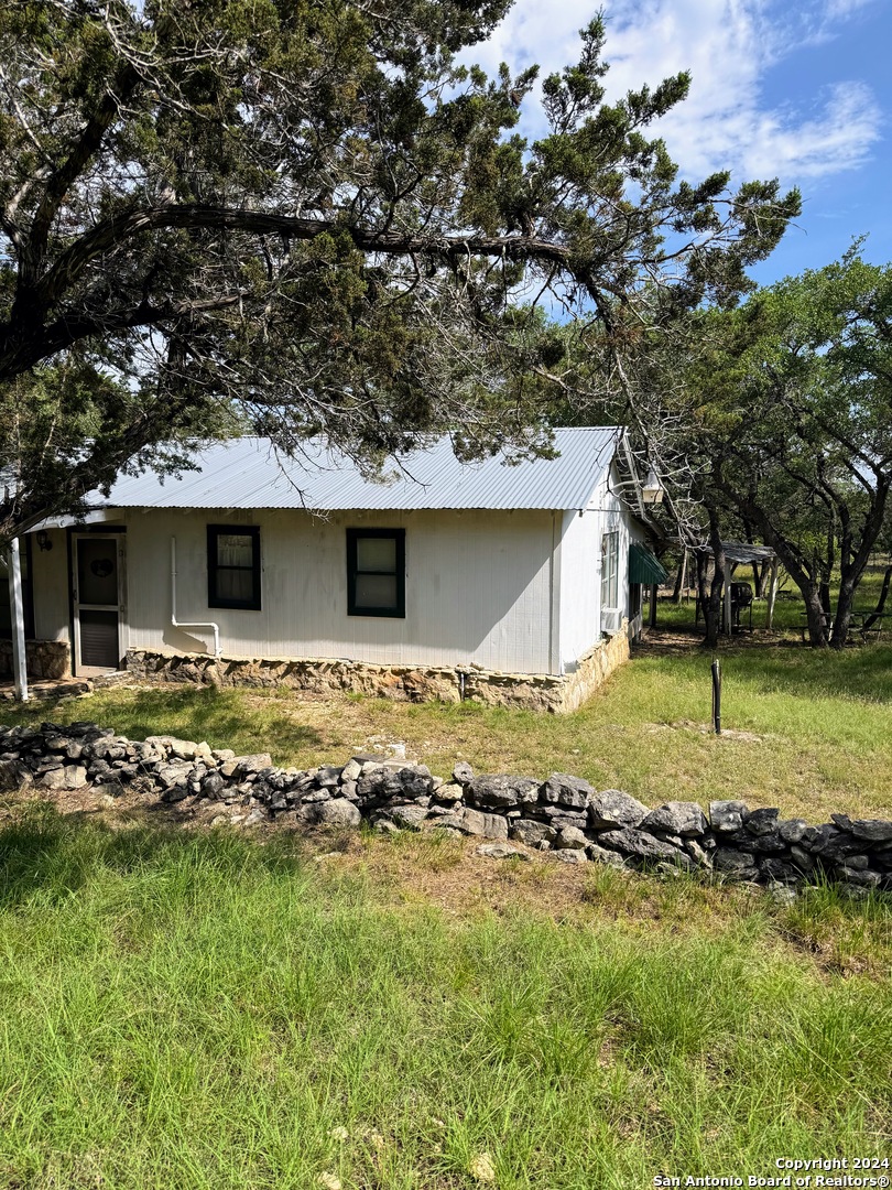 201 Cypress Bluff Road Pipe Creek, TX 78063 - Photo 9 of 16 a view of a house with garden