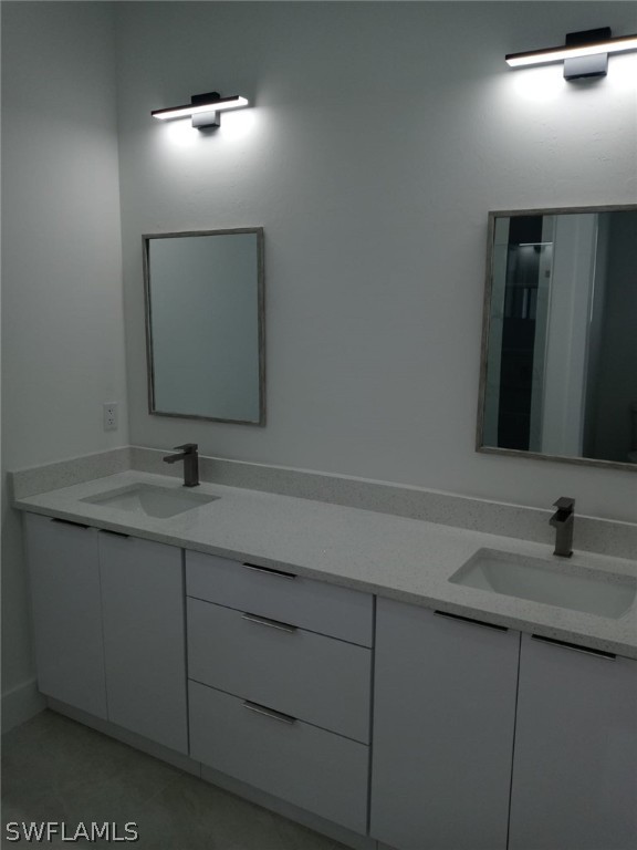 810 Homestead Road South Lehigh Acres, FL 33974 - Photo 11 of 18 a bathroom with a sink and mirror