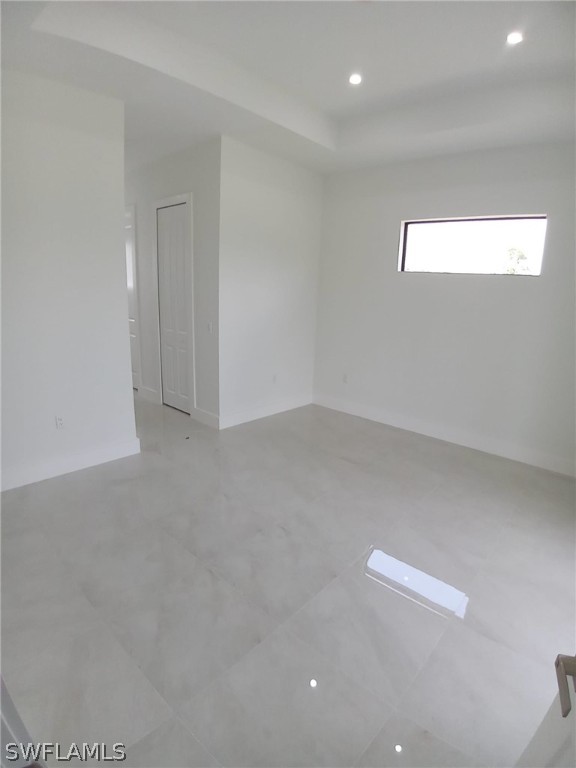810 Homestead Road South Lehigh Acres, FL 33974 - Photo 8 of 18 a view of an empty room with a window