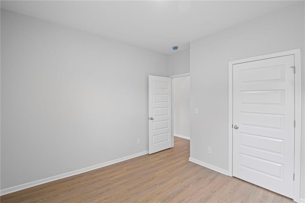 3650 River Rock Road Lithonia, GA 30038 - Photo 18 of 42 wooden floor in an empty room