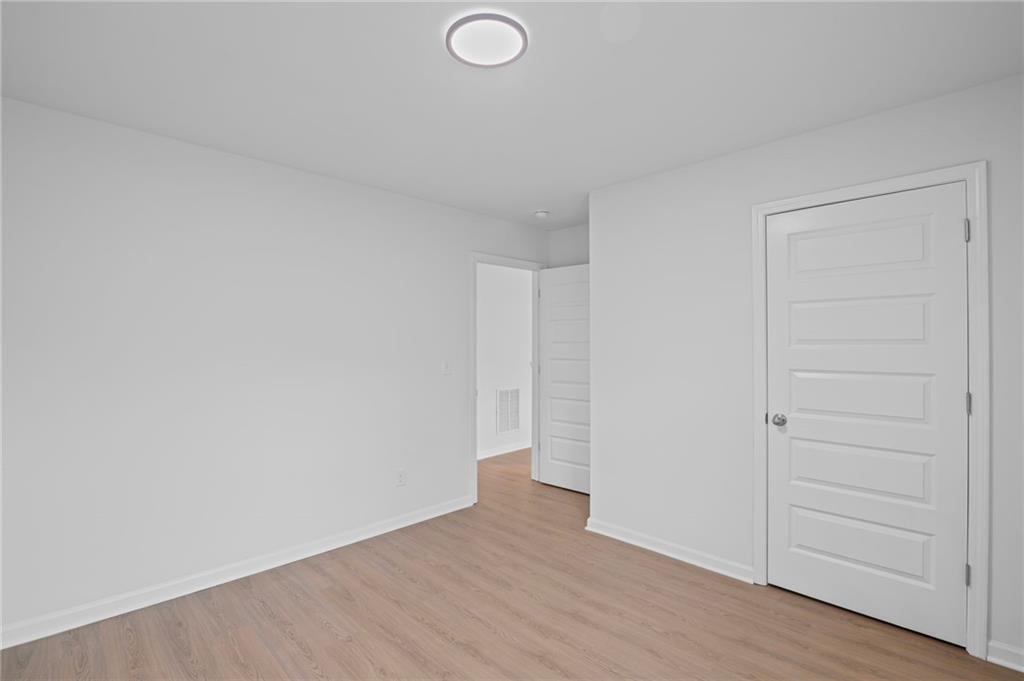 3650 River Rock Road Lithonia, GA 30038 - Photo 33 of 42 wooden floor in an empty room