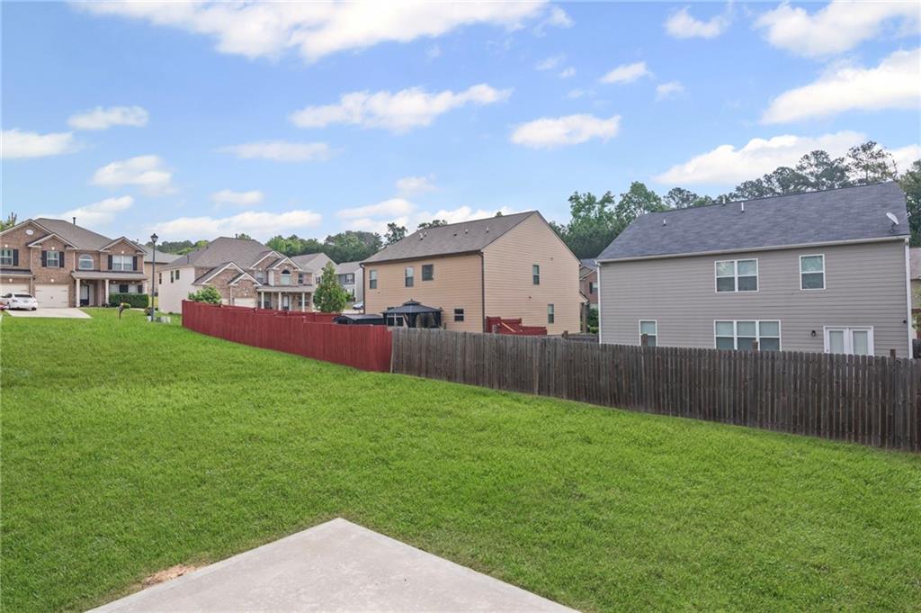 3650 River Rock Road Lithonia, GA 30038 - Photo 38 of 42 a view of yard with small huts and green space