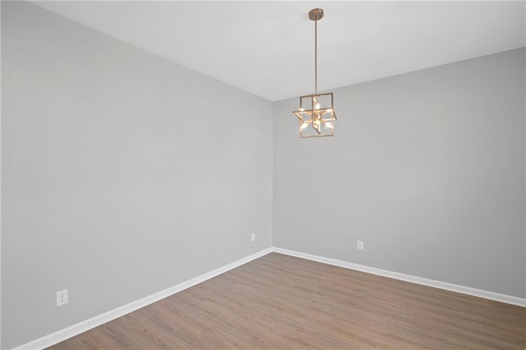3650 River Rock Road Lithonia, GA 30038 - Photo 5 of 42 a view of a room with wooden floor and window