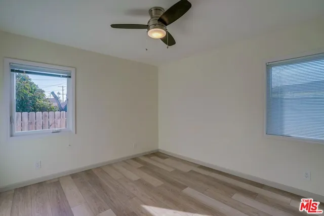 a view of empty room with windows