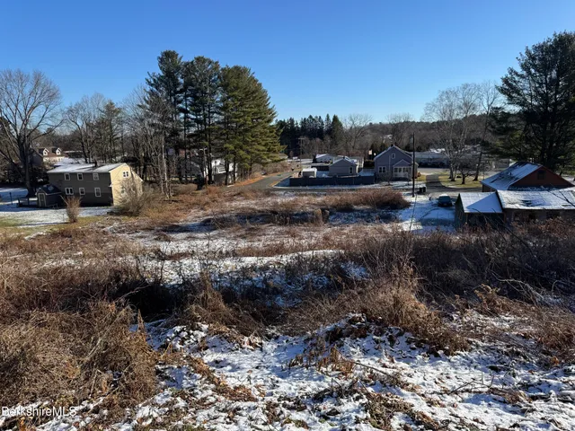 a view of a town with trees around