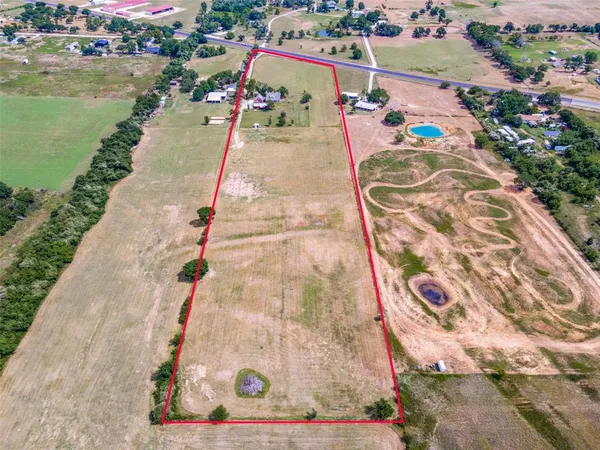 an aerial view of a house with outdoor space lake view