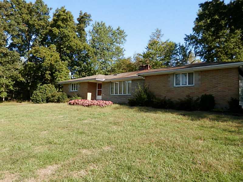 782 Arona Road New Stanton, PA 15672 - Photo 2 of 19 Exterior Front. Surrounded by mature landscaping.