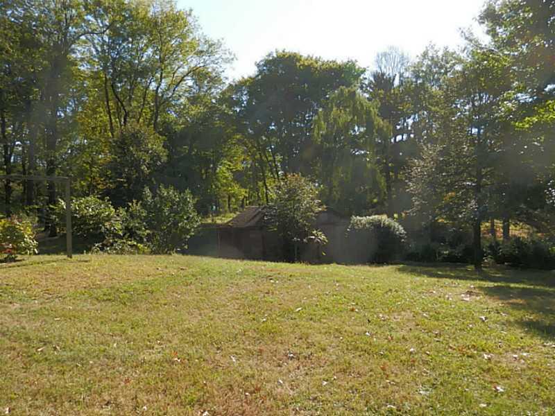 782 Arona Road New Stanton, PA 15672 - Photo 3 of 19 Exterior Front. Side yard - rear yard - all mature with perennials.