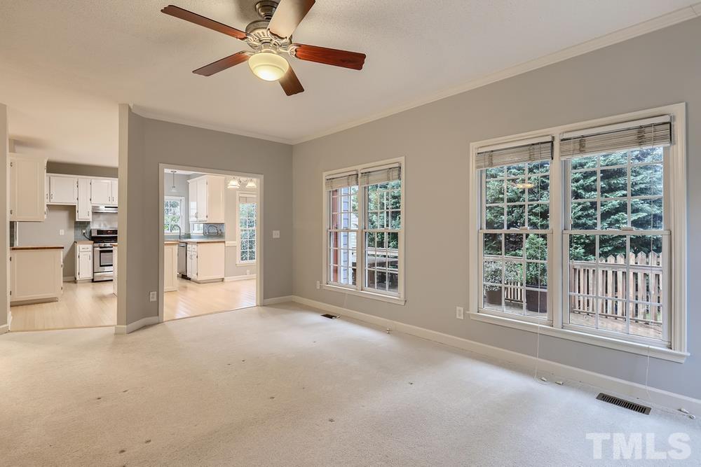 5405 Staysail Court Raleigh, NC 27613 - Photo 22 of 28 a view of livingroom with a ceiling fan and window