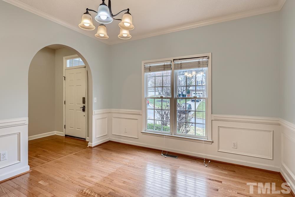 5405 Staysail Court Raleigh, NC 27613 - Photo 4 of 28 wooden floor in an empty room with a window