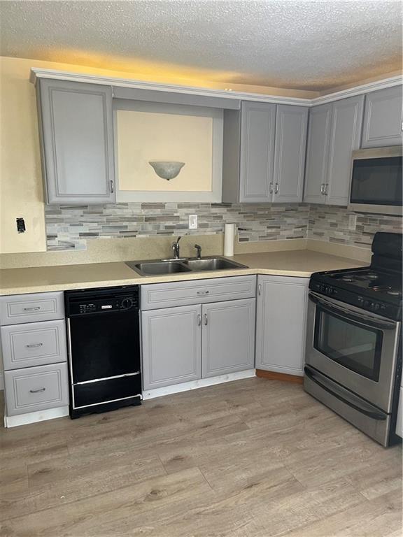 2517 Monroeville Boulevard Monroeville, PA 15146 - Photo 12 of 24 a kitchen with granite countertop a sink stainless steel appliances and cabinets