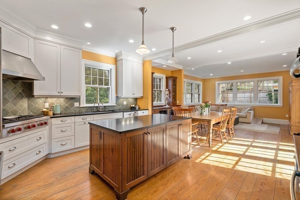 37 Circuit Road Brookline, MA 02467 - Photo 17 of 37 a large kitchen with lots of counter space dining table and stainless steel appliances
