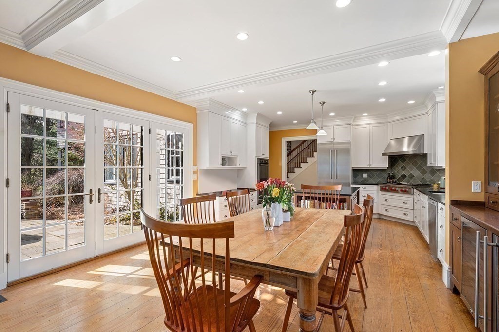 37 Circuit Road Brookline, MA 02467 - Photo 18 of 37 a dining room with furniture a rug and kitchen view
