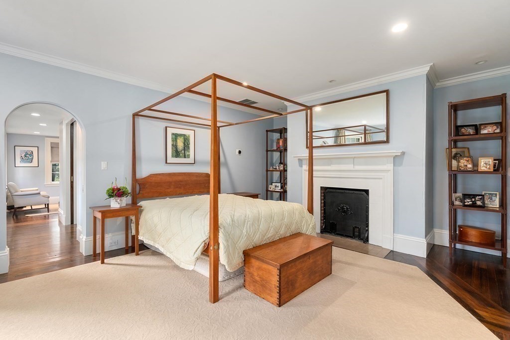 37 Circuit Road Brookline, MA 02467 - Photo 25 of 37 a bedroom with a bed and a fireplace