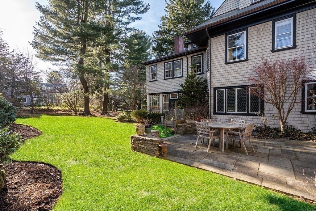 37 Circuit Road Brookline, MA 02467 - Photo 35 of 37 a backyard of a house with table and chairs