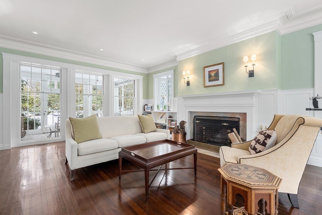 37 Circuit Road Brookline, MA 02467 - Photo 8 of 37 a living room with furniture a table and a fireplace