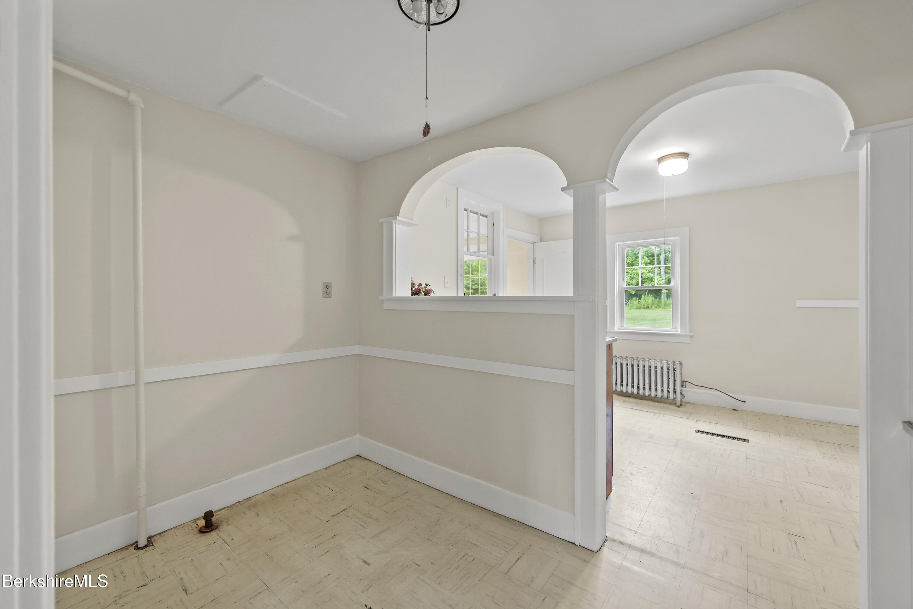 132 South Washington State Road Washington, MA 01223 - Photo 12 of 41 an empty room with a windows and chandelier