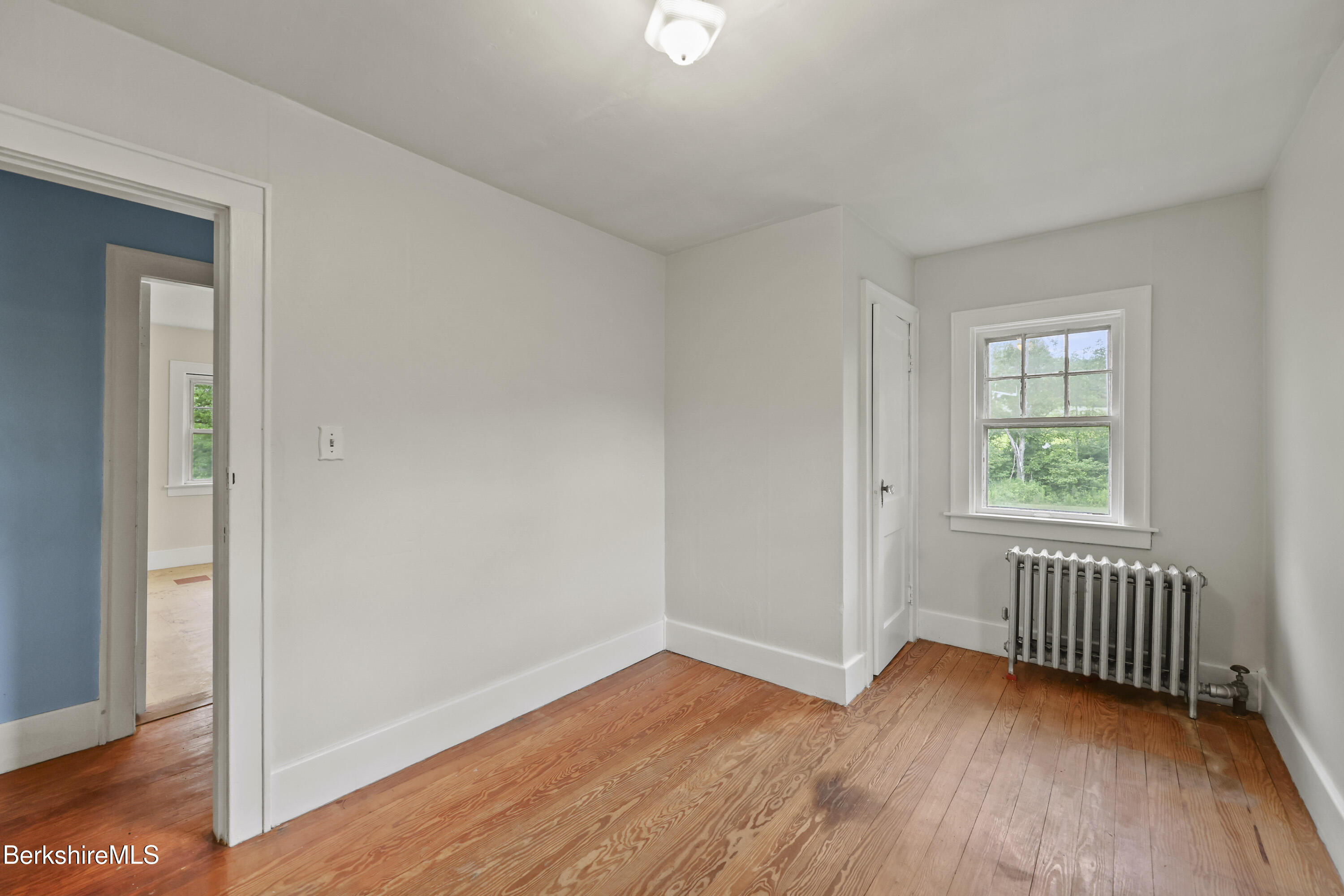 132 South Washington State Road Washington, MA 01223 - Photo 23 of 41 an empty room with wooden floor and windows